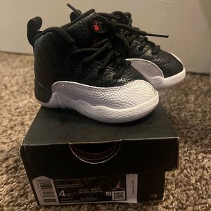 Toddler 4c Jordan retro 12, black and white, worn once. Still in box.